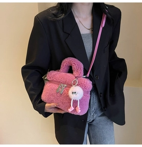 Chic pink fuzzy lamb wool handbag styled with casual blazer and denim jeans