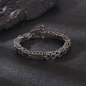 Detailed view of stainless steel Byzantine chain bracelet with horseshoe buckle clasp