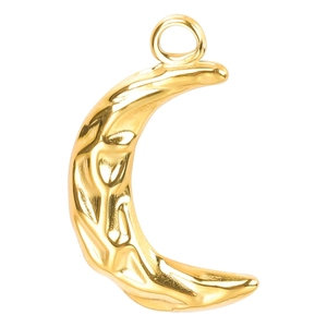 Macro shot of 18k gold moon pendant with hammered texture and polished metal surface