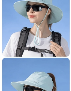 Détail d'un chapeau de soleil bleu clair avec broderie montagne et cordon réglable