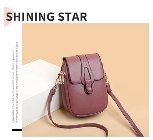 Close-up of mauve textured leather crossbody phone bag with gold double zipper details