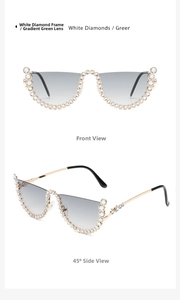 Detail view of wavy rimless sunglasses with white rhinestones and green gradient lenses