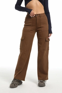 Detail of high waist elastic waistband and button closure on brown cotton cargo pants