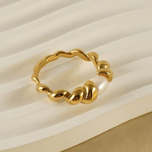 18k gold plated stainless steel twisted ring featuring a natural white pearl on a wave surface