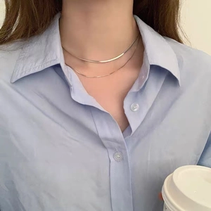 Double-layer gold snake chain and bead necklace set shown on a model neck