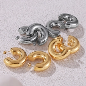 Polished gold and silver thick C-shape hoop earrings in minimalist geometric design