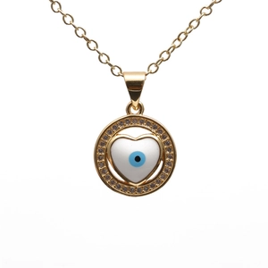 Golden heart necklace with evil eye design and micro-set zircon stones on white background