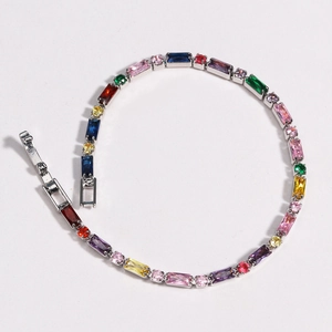 Detail of multi-color gemstone bracelet with rectangular zircons on silver plated chain