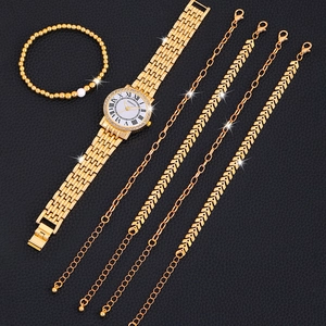 Elegant gold quartz watch set for women with matching bracelets on black leather