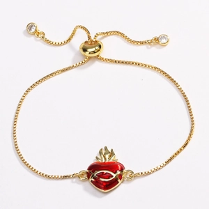 Adjustable gold bracelet featuring red enamel heart charm and zircon stone details