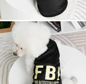 Close-up of black FBI printed pet vest on a white dog showing fabric texture and detail