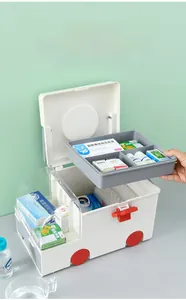 Close-up of double-deck medicine box showing the removable tray and clear lid design
