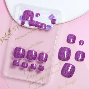 Detail view of sparkling purple glitter press-on toenails in a premium transparent set