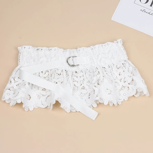 Detailed close-up of white lace waist belt featuring decorative silver double ring buckle