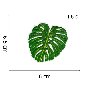 Close-up of monstera leaf embroidery patch with detailed size measurements and texture