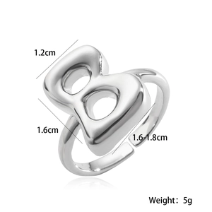 Macro shot of silver letter B ring showing detailed dimensions and adjustable inner band