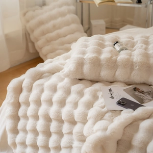 Creamy white plush faux rabbit fur blanket with luxury 3D wave texture and matching pillow