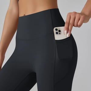 Detail of high waisted yoga leggings featuring a functional side pocket for mobile phone