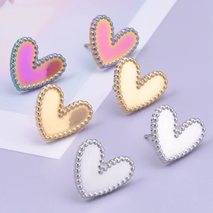 Three pairs of heart earrings in iridescent, gold, and white with milgrain edge detailing