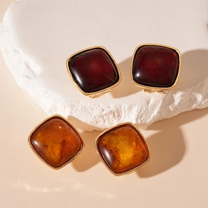 Vintage square resin stud earrings in wine red and amber with gold-plated metal borders