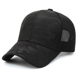 Black camo trucker hat with breathable mesh and curved brim in side view