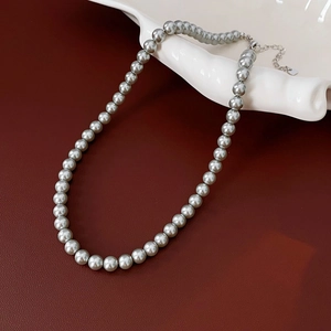 Detail of grey pearl necklace with silver adjustable lobster clasp and extension chain