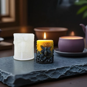 3D bee honeycomb silicone mold for DIY candle making on a dark textured stone plate