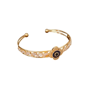 Bracciale occhio del male dorato con motivo a fiori e zirconi in stile vintage