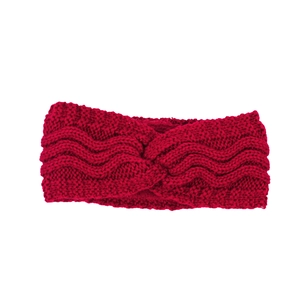 Macro view of red knitted headband with twisted knot design and thick wool texture