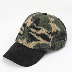Close-up of winter camo baseball cap featuring fleece texture and black corduroy brim
