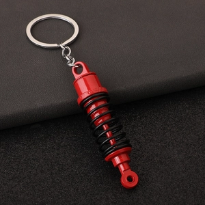 Car shock absorber keychain with red spring and black suspension metal model ring