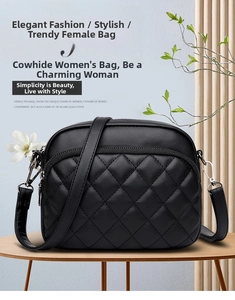 Close-up of black quilted genuine cowhide leather crossbody bag with double zippers