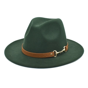 Close-up of dark green fedora with brown faux leather band and golden horsebit buckle