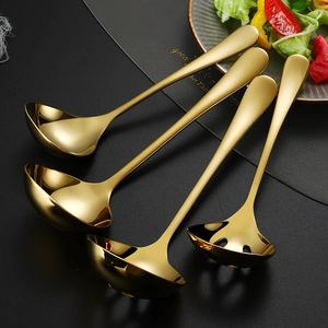 Golden 304 stainless steel soup spoons and colanders set on professional black background