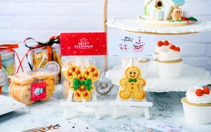 Detailed close-up of packaged Christmas gingerbread man and candy cane cookies with festive cards