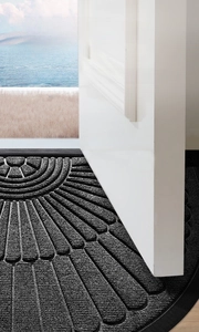 Detailed view of ultra-thin semi-circle rubber doormat fitting perfectly under the door