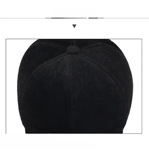 Close-up of winter baseball cap seams and metal letter logo on thick faux mink fur