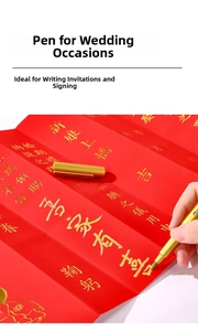 Metallic gold marker pen detail writing on red wedding invitation with fine tip