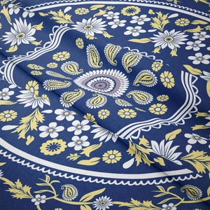 Close-up of bohemian blue mandala tapestry showing intricate paisley fabric texture