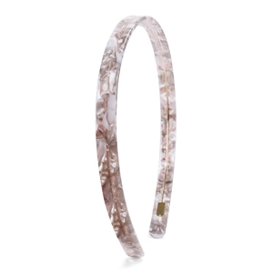 Detail of pink marble acetate headband showing the anti-slip steel wire structure inside