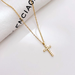 Exquisite gold cross pendant necklace with white zircon pavé on a delicate cable chain