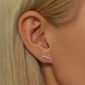 Close-up of S925 silver gold-plated ear stud featuring clustered white opals and zircons