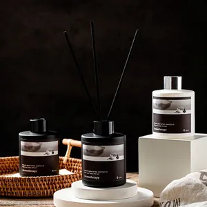 Lavender aromatherapy reed diffuser set in frosted black and white glass bottles