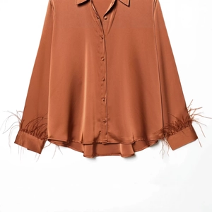 Brown satin shirt with feather trim cuffs and lapel collar for an elegant look
