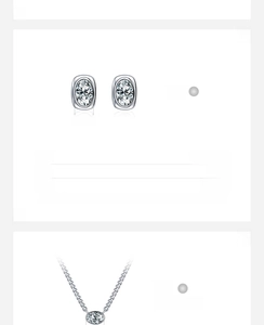Detailed view of S925 silver jewelry set featuring oval cubic zirconia studs and necklace