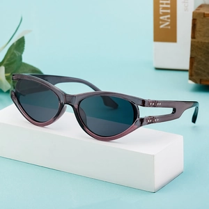 Chic oval cat-eye sunglasses in translucent purple-grey on white geometric stand