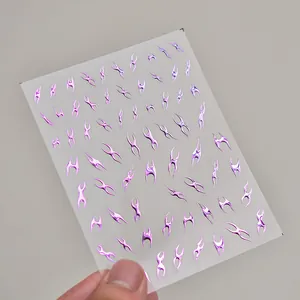 Detail of laser silver holographic fire patterns on thin self-adhesive nail stickers