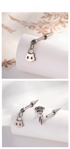 Detail of titanium cat-shaped ear stud showing screw thread design and components