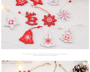 Flat lay of red and white wooden Christmas ornaments including deer, stars and trees