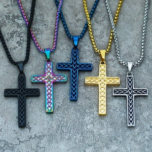 Detailed display of five colorful stainless steel cross pendants with woven textures